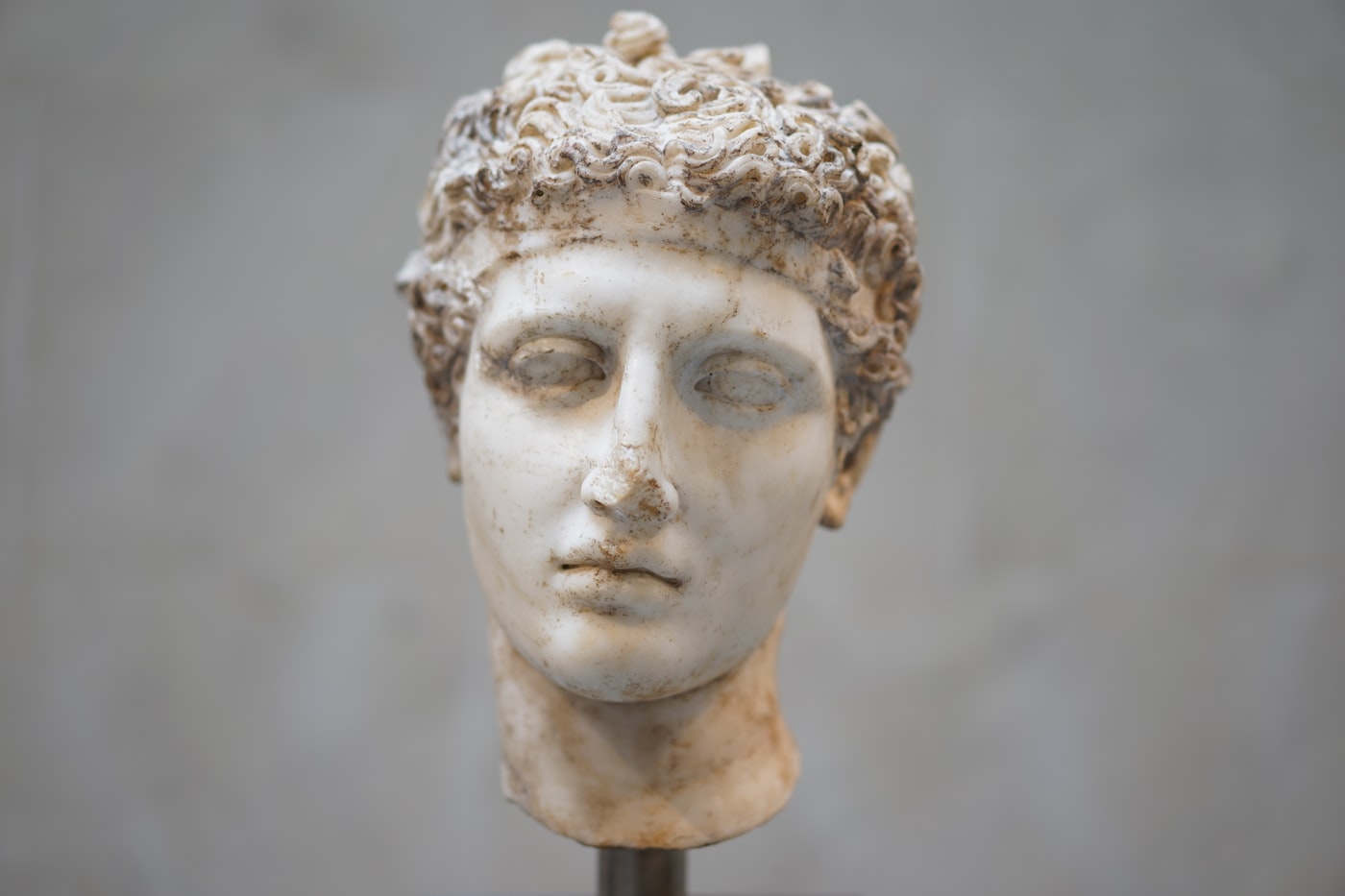 A weathered classical marble bust, in the tradition of the ancient teacher-philosophers