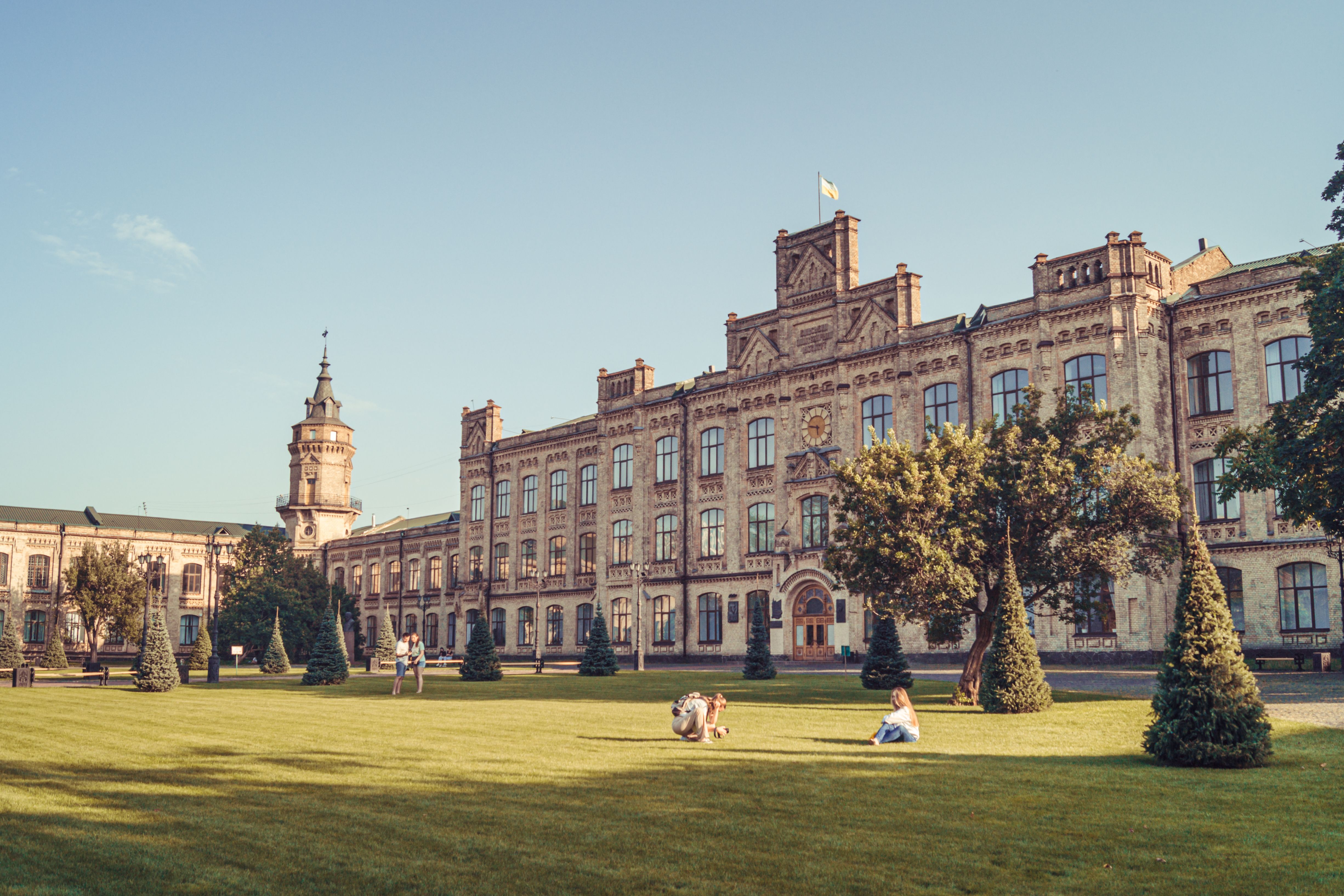 A historic university building on a sunlit afternoon