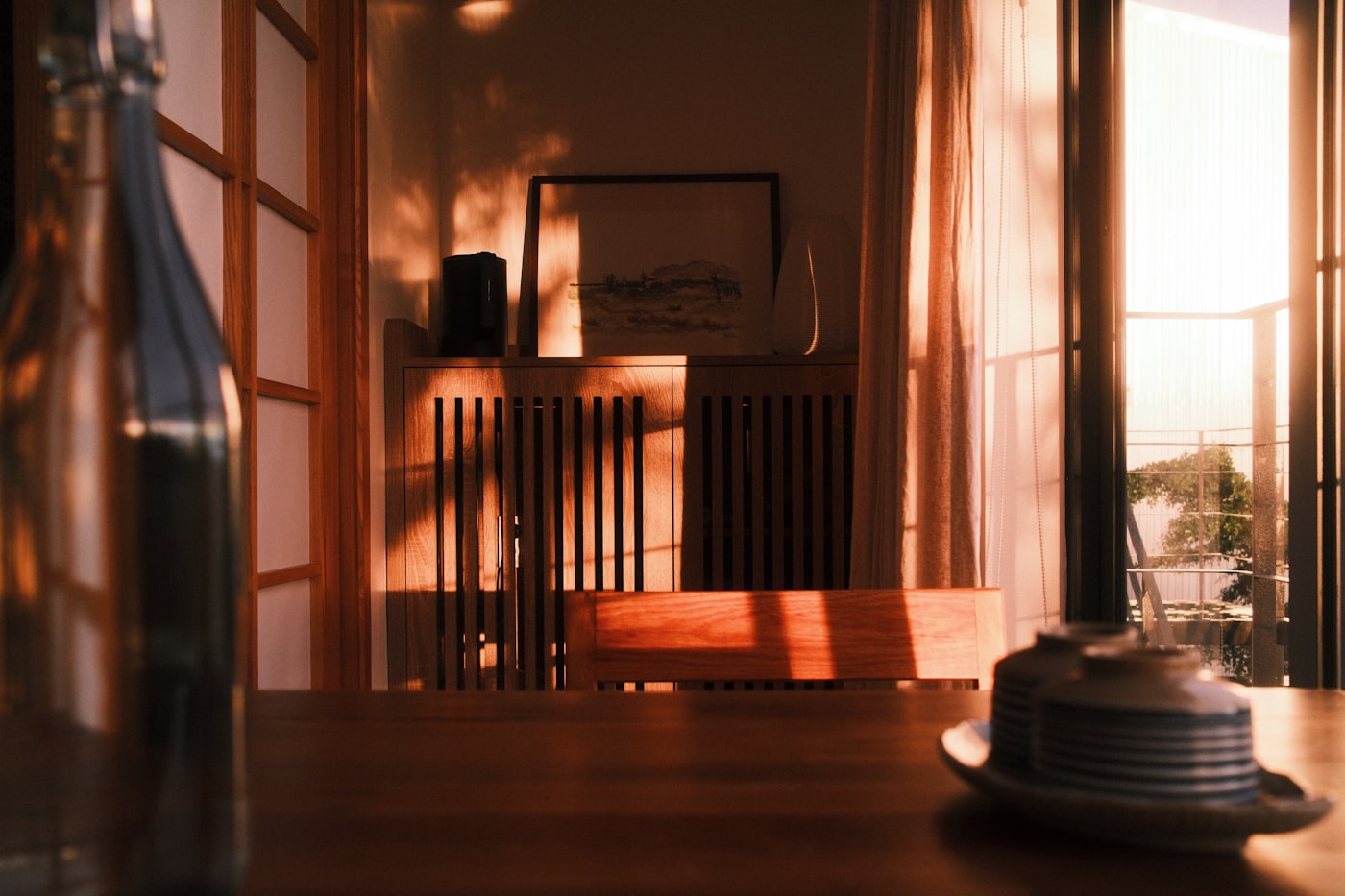 A warm, sunlit family dining room in the golden light of late afternoon